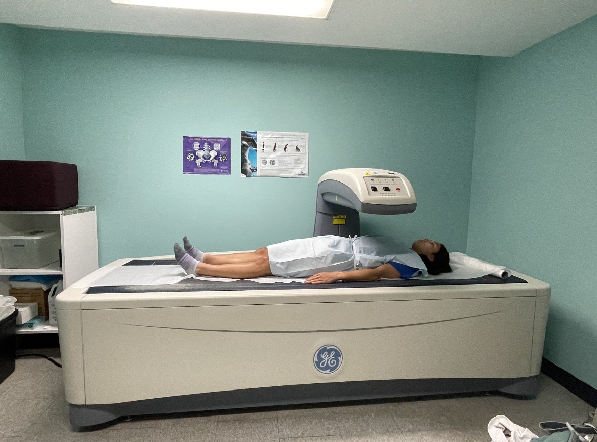 A woman laying on a bed in a room.